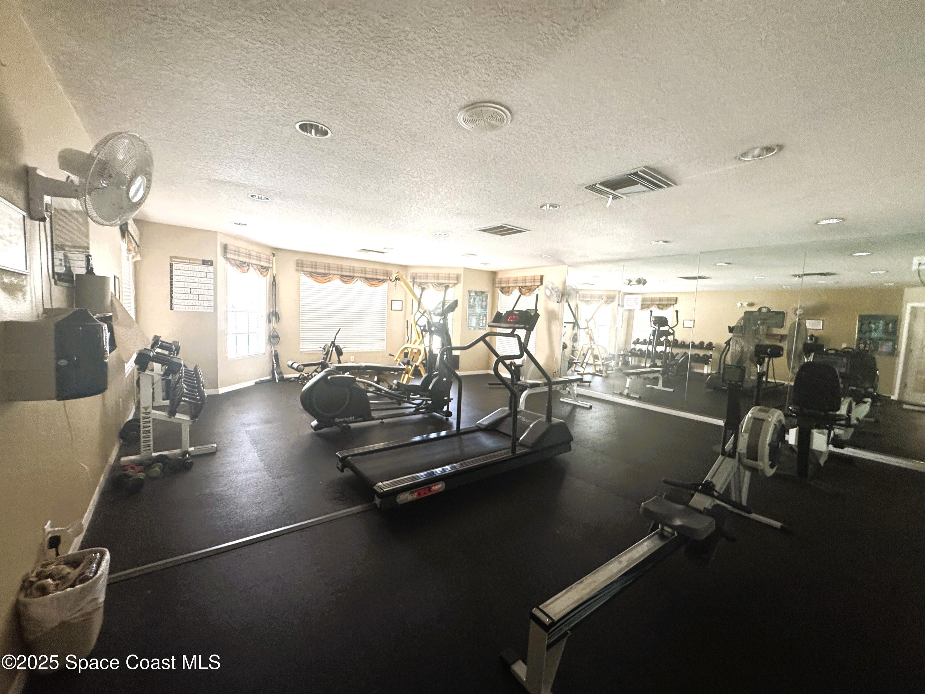 1861 Long Iron Drive, Unit 1121 Rockledge, FL 32955 - Photo 29 of 35 a view of a room with gym equipment