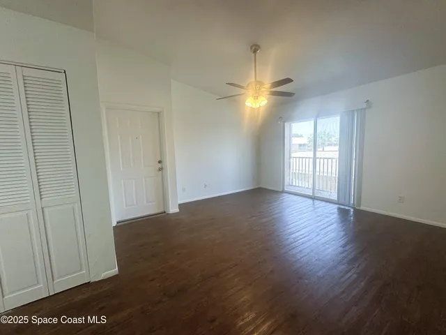 a view of balcony with wooden floor