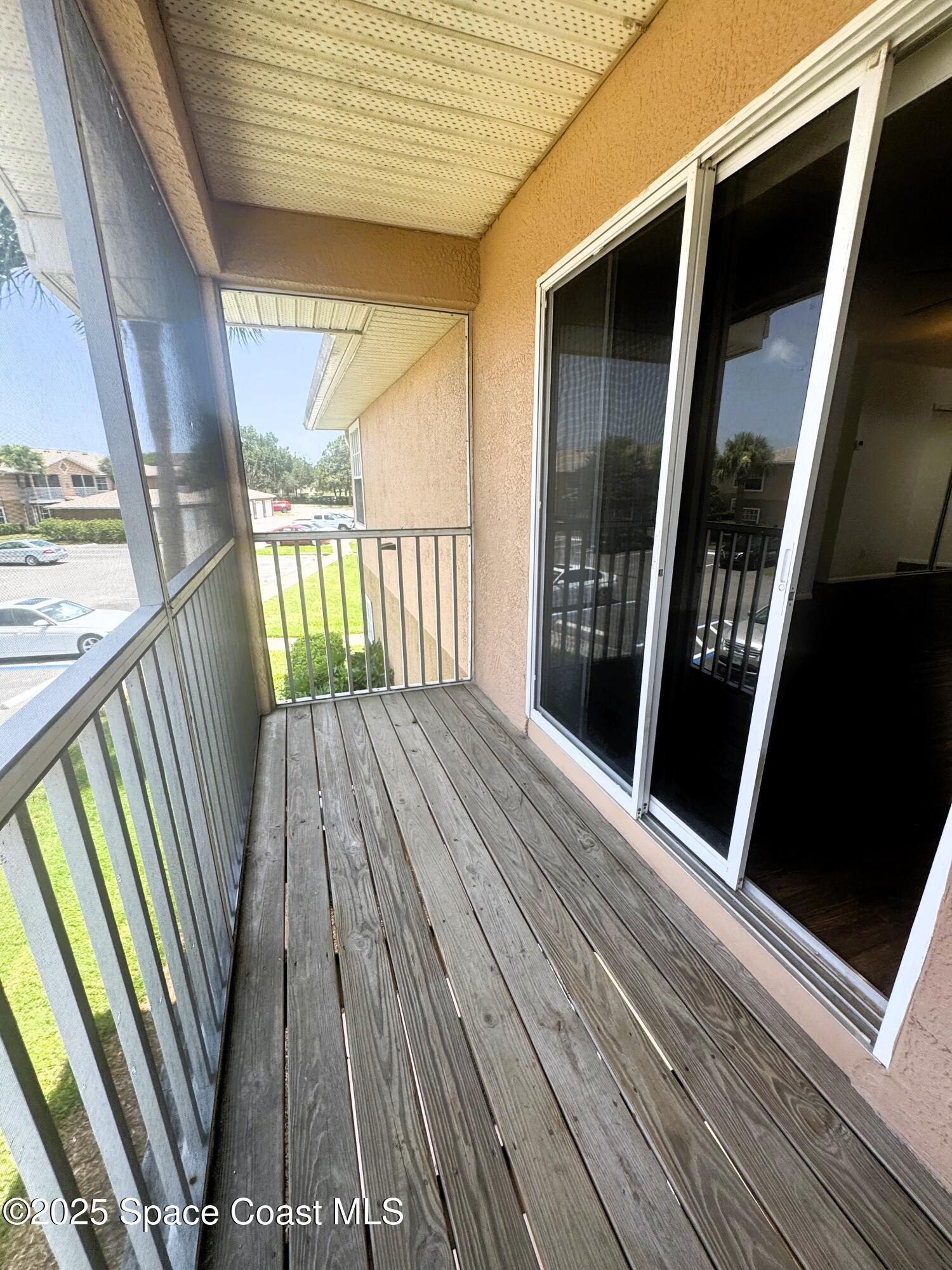1861 Long Iron Drive, Unit 1121 Rockledge, FL 32955 - Photo 9 of 35 a view of balcony with wooden floor