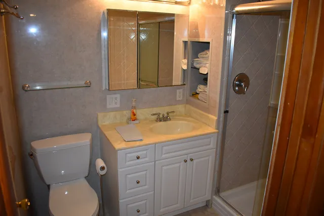 a dining room with furniture and chandelier