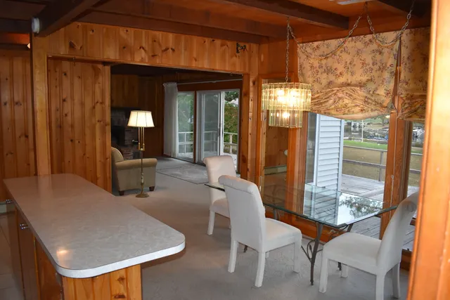 a dining room with furniture and window