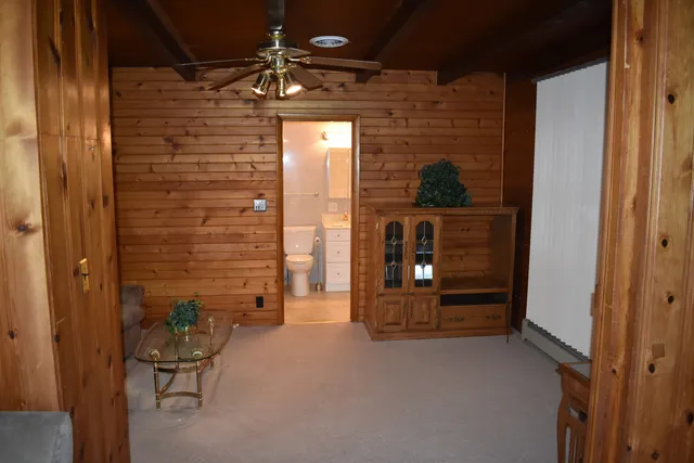 a view of a hallway with seating area