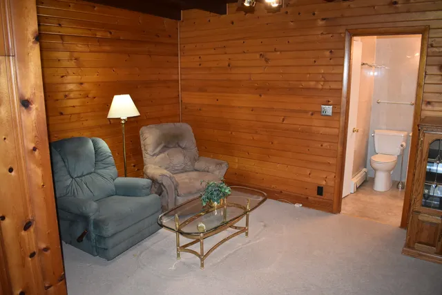 a living room with furniture and a gate
