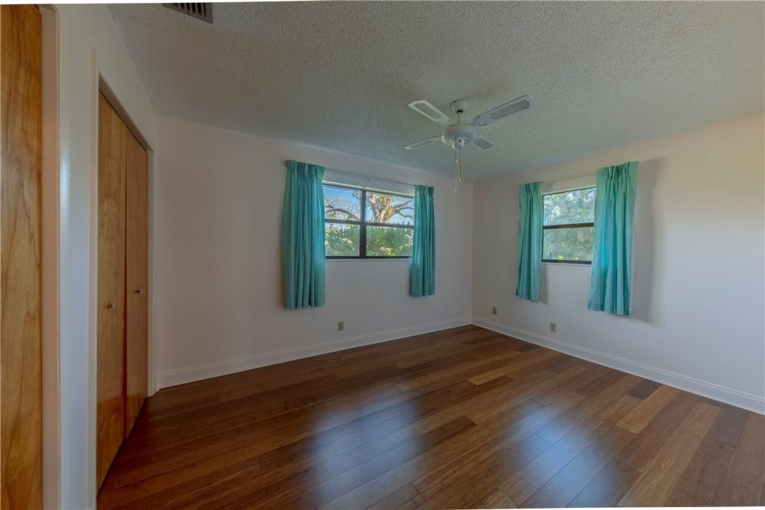 12500 Lake Road Davie, FL 33325 - Photo 18 of 34 an empty room with wooden floor and windows