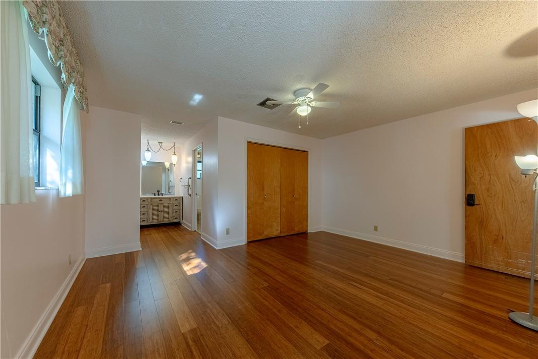 12500 Lake Road Davie, FL 33325 - Photo 5 of 34 a view of an empty room with wooden floor and a window