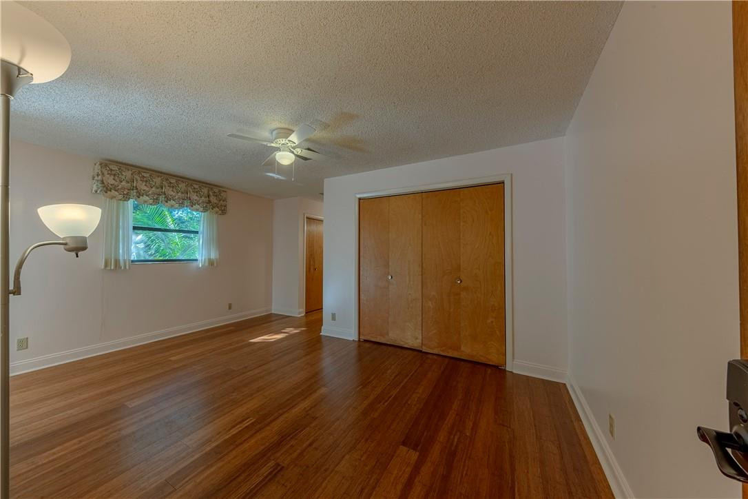 12500 Lake Road Davie, FL 33325 - Photo 6 of 34 a view of an empty room with wooden floor and a window