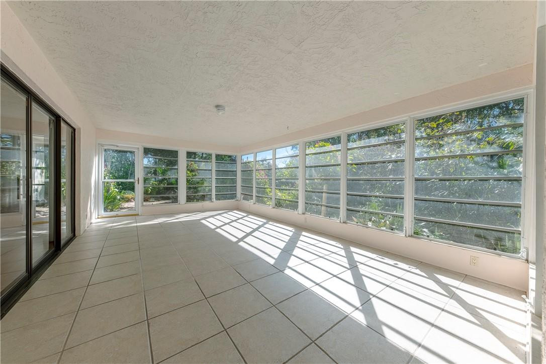 12500 Lake Road Davie, FL 33325 - Photo 9 of 34 a view of empty room with wooden floor and fan