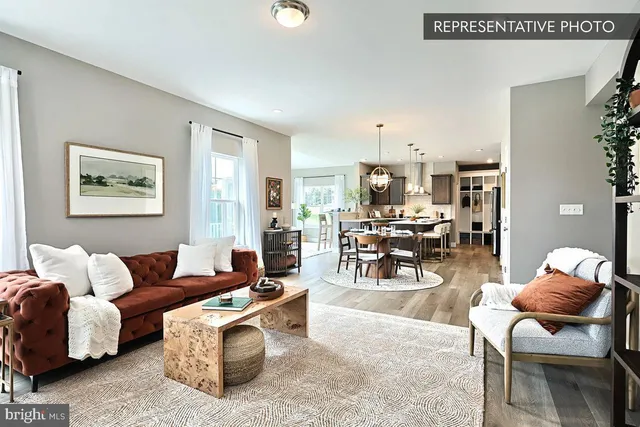 a living room with furniture and a table