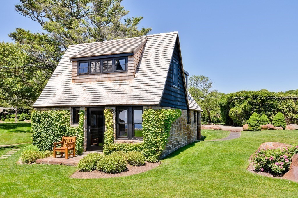 9 Drumhack Road Gloucester, MA 01930 - Photo 24 of 28 a view of a house with a yard and potted plants