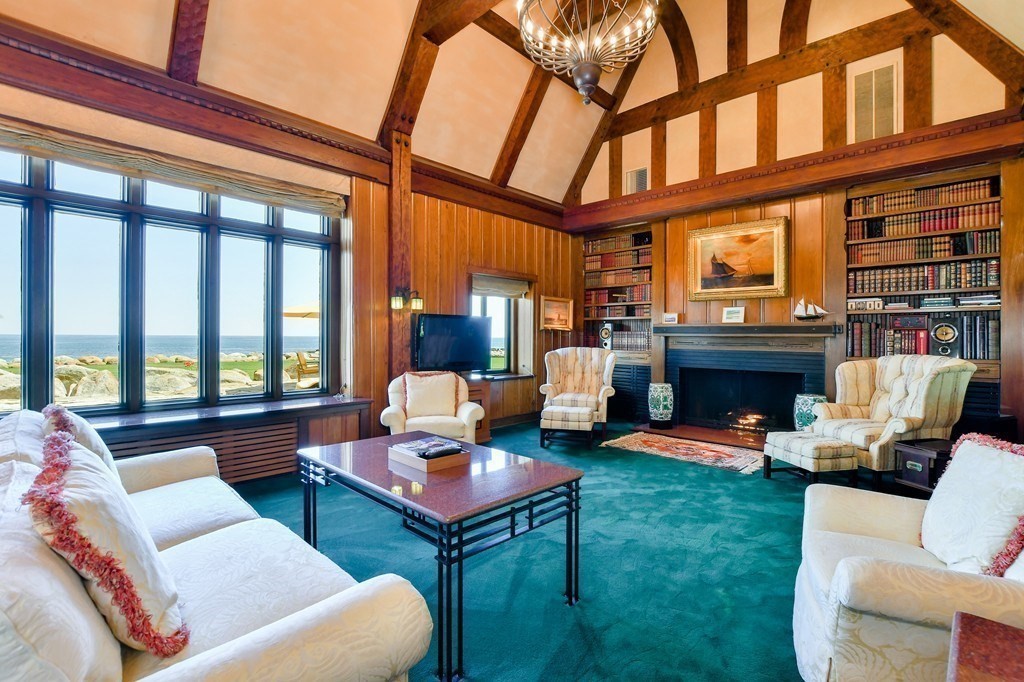 9 Drumhack Road Gloucester, MA 01930 - Photo 6 of 28 a living room with furniture a fireplace and a large window