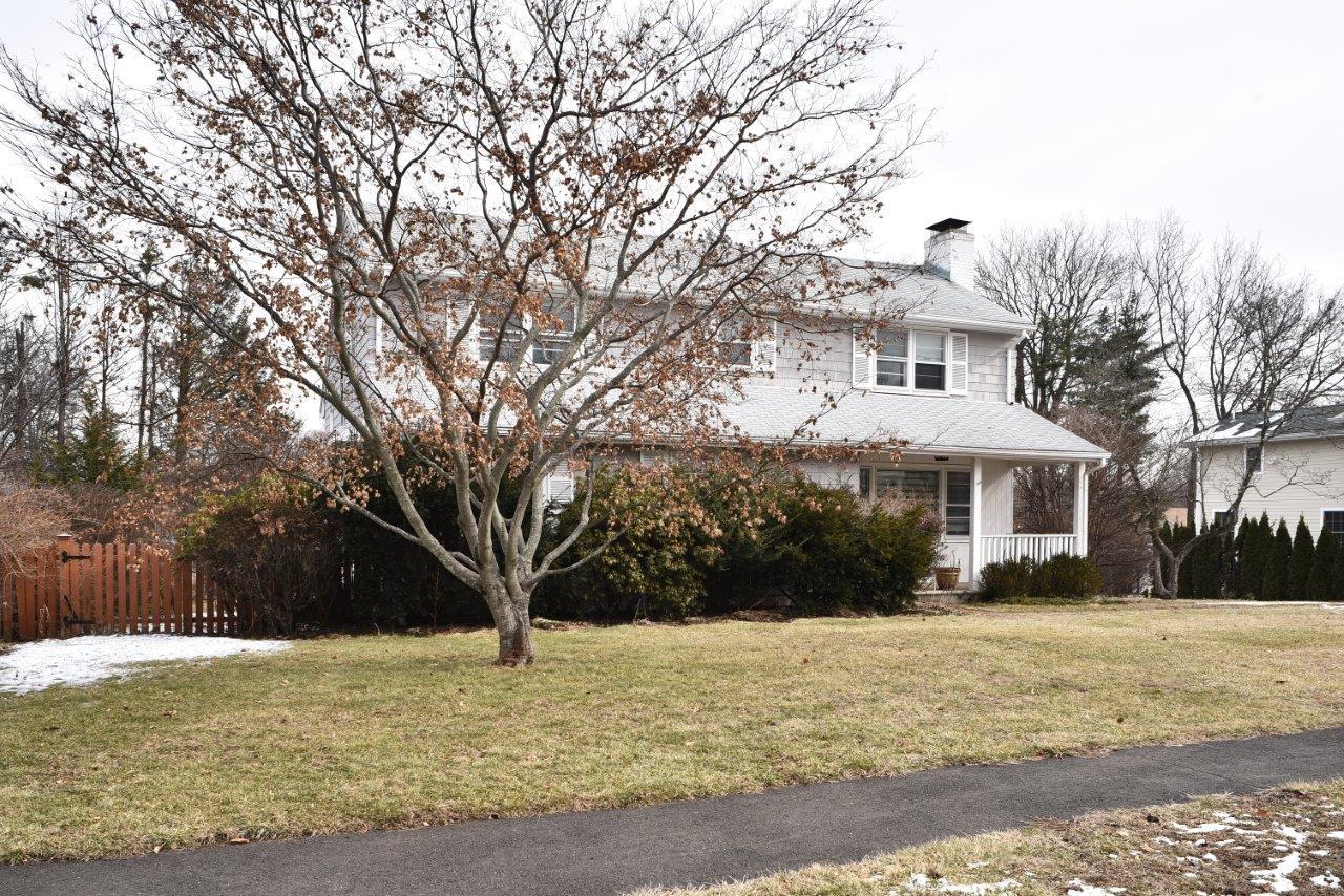 17 Field Crest Road New Canaan, CT 06840 - Photo 1 of 37 a front view of house with yard covered with trees