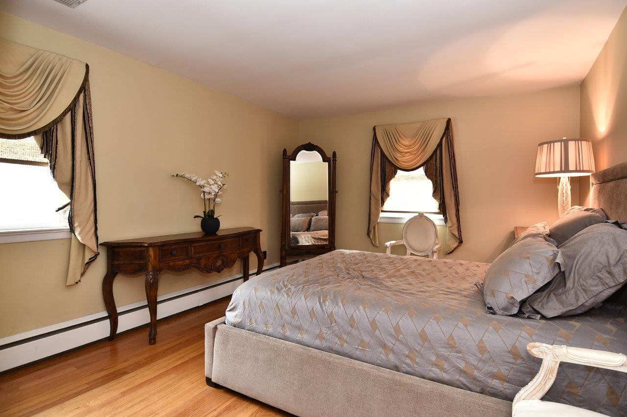 17 Field Crest Road New Canaan, CT 06840 - Photo 23 of 37 a bedroom with a bed and a dresser