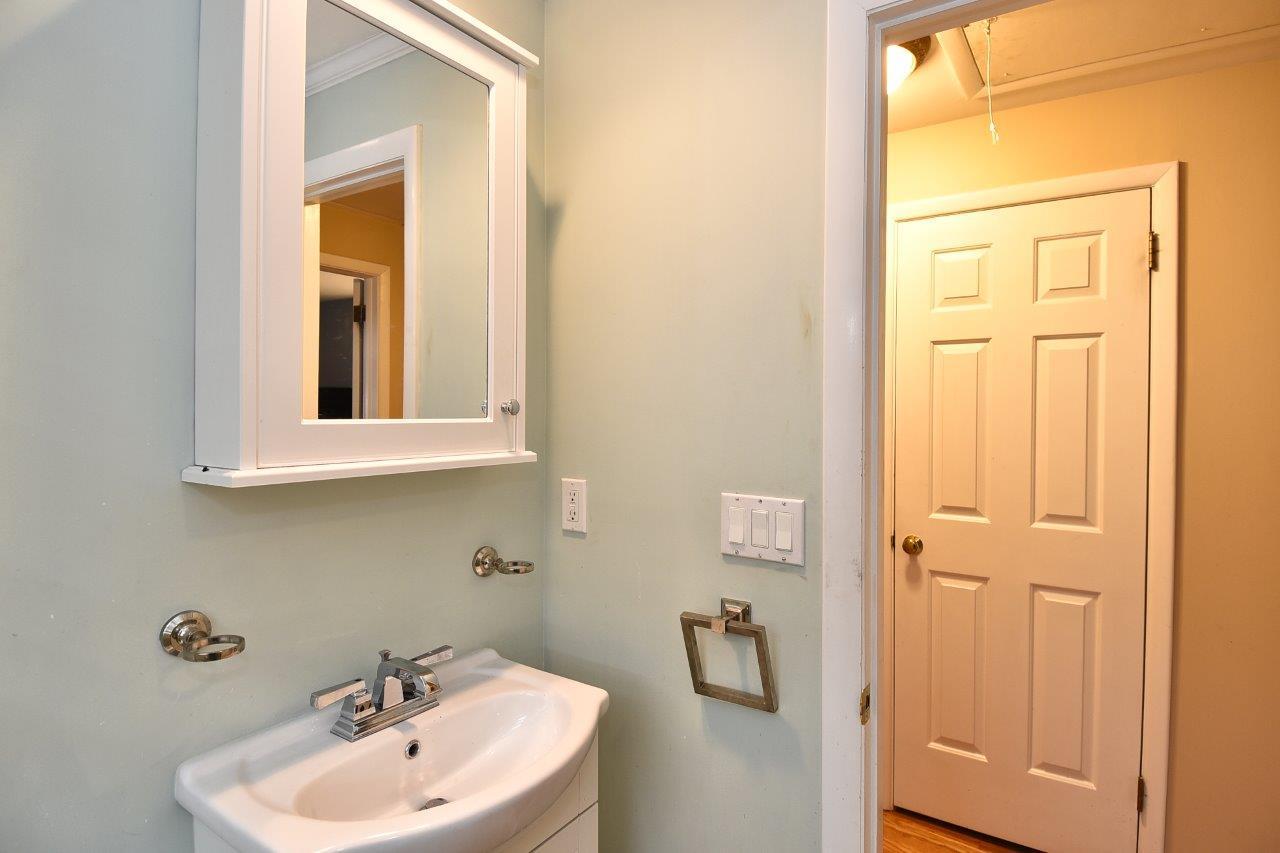 17 Field Crest Road New Canaan, CT 06840 - Photo 30 of 37 a bathroom with a sink and a mirror
