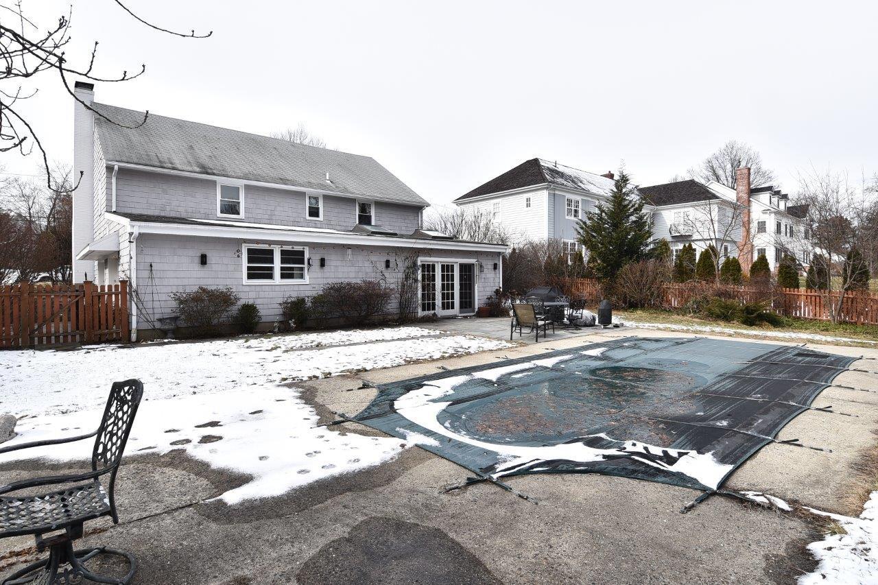 17 Field Crest Road New Canaan, CT 06840 - Photo 35 of 37 a view of a house with a swimming pool