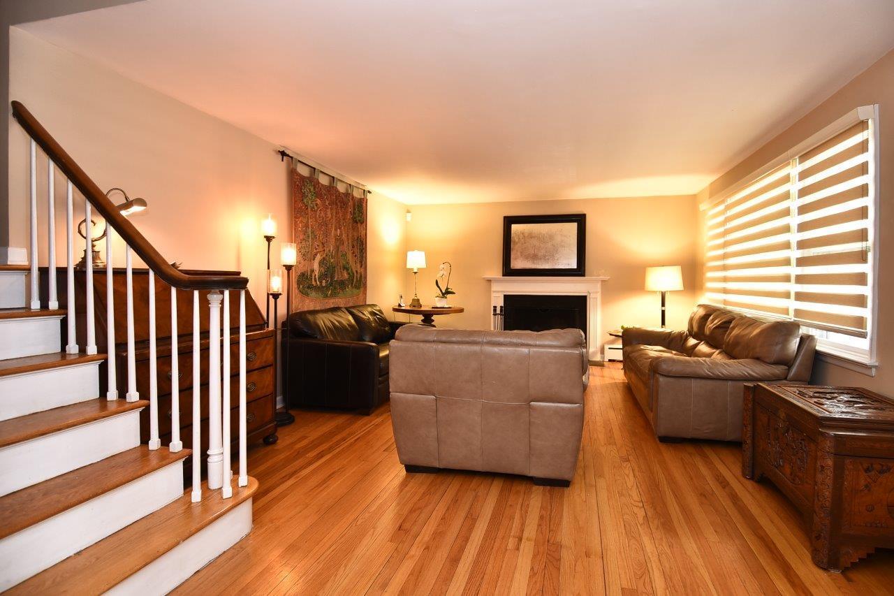 17 Field Crest Road New Canaan, CT 06840 - Photo 9 of 37 a living room with furniture and a wooden floor