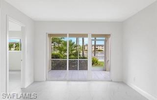 1018 Manatee Road, Unit E107 Naples, FL 34114 - Photo 4 of 15 Spare room with baseboards