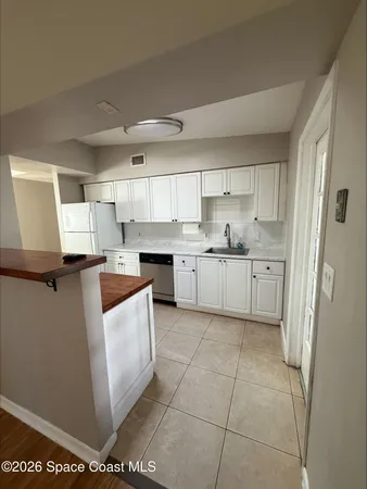 a kitchen with stainless steel appliances granite countertop a sink and a stove top oven