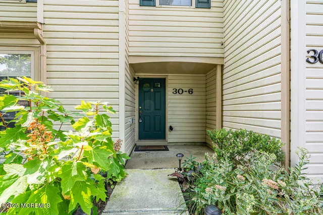 a front view of a house with a garage