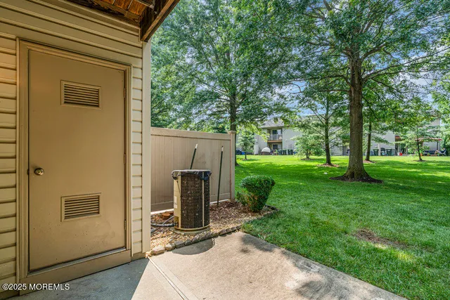 a huge green field with lots of trees