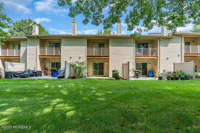 a view of a house with a door and wooden floor