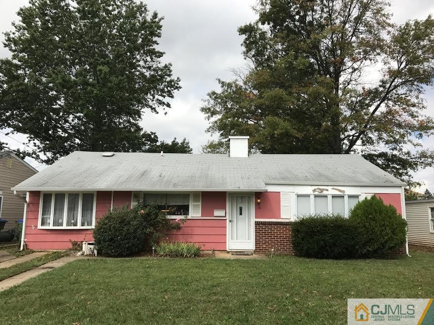 16 Matson Road Edison, NJ 08817 - Photo 1 of 2 a front view of a house with a yard and garage