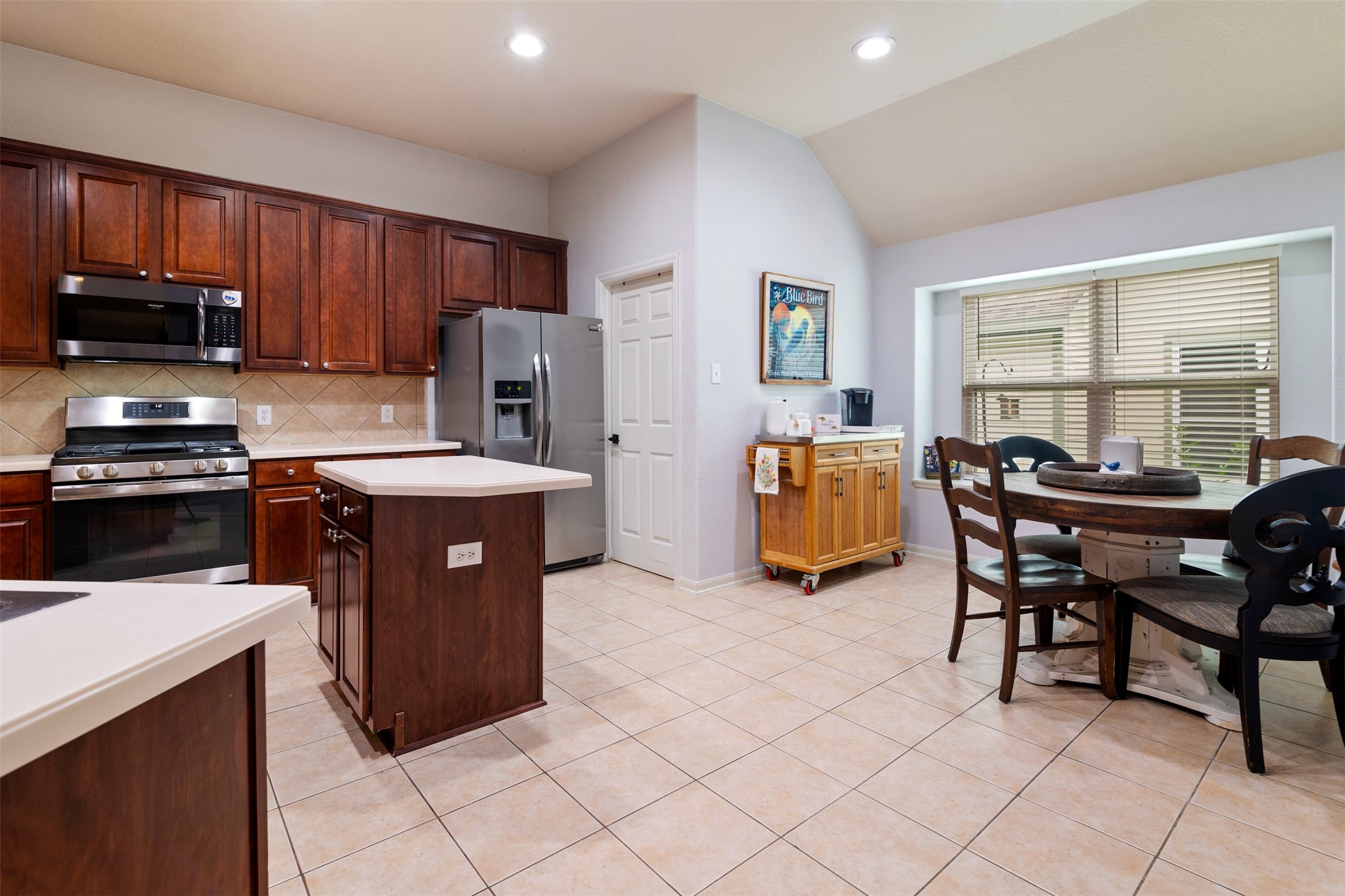 19306 Young Oak Street Spring, TX 77379 - Photo 12 of 28 View from the family room into the kitchen and breakfast room.