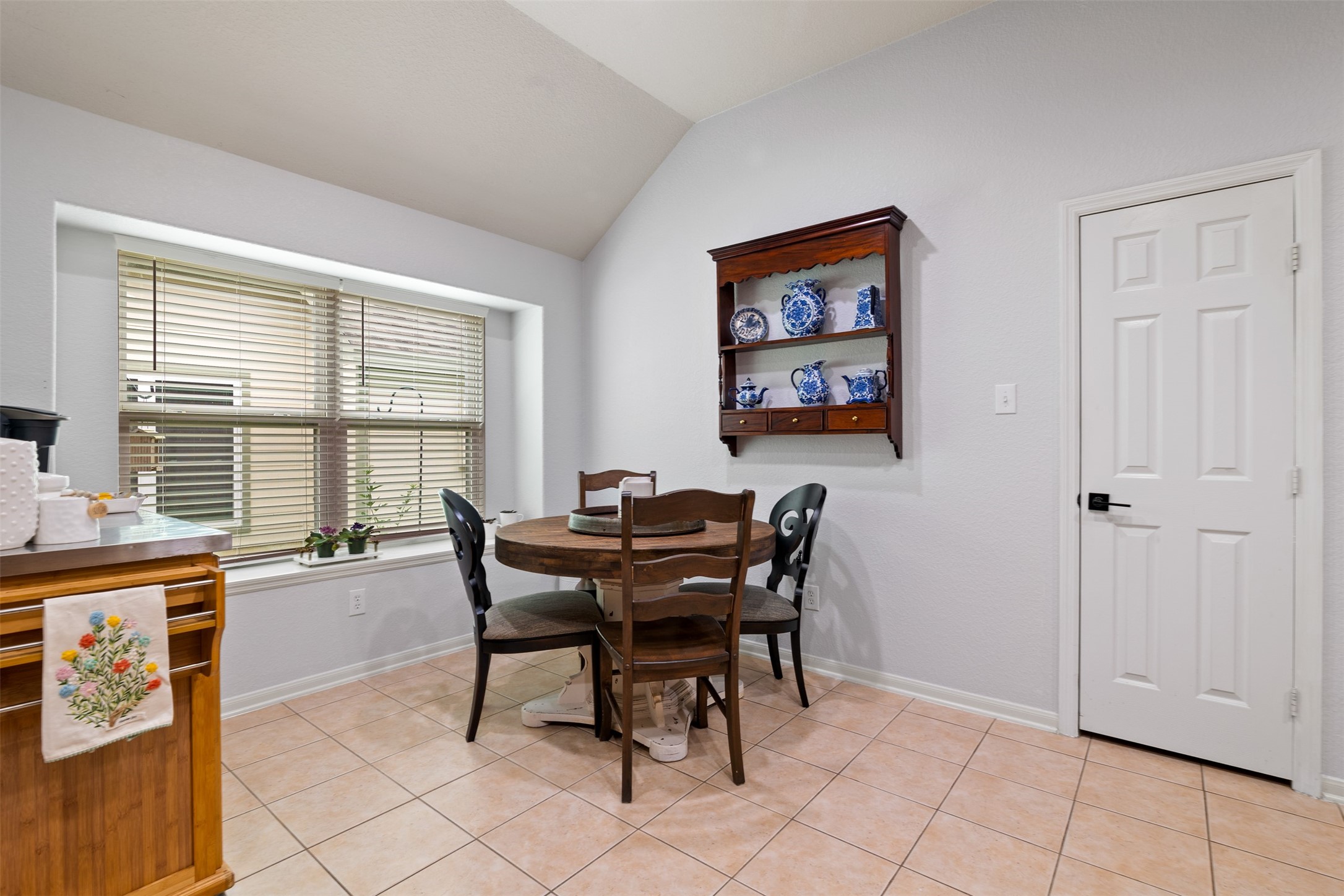19306 Young Oak Street Spring, TX 77379 - Photo 13 of 28 The breakfast room has ledge window, tile floors and plenty of space for any size table.