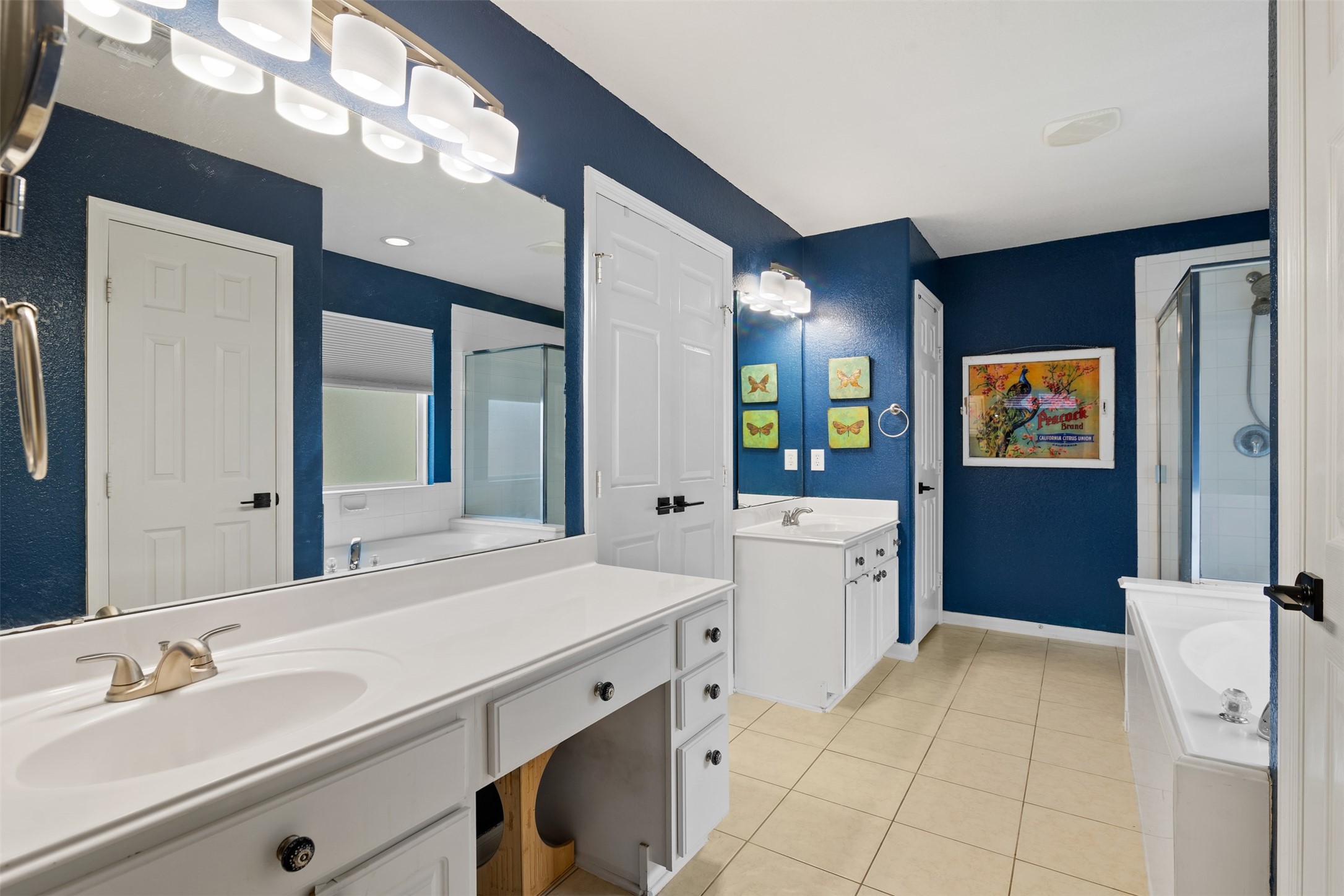 19306 Young Oak Street Spring, TX 77379 - Photo 16 of 28 Primary bathroom features double vanities to include knee space vanity, tile floors, double door entry and linen closet.