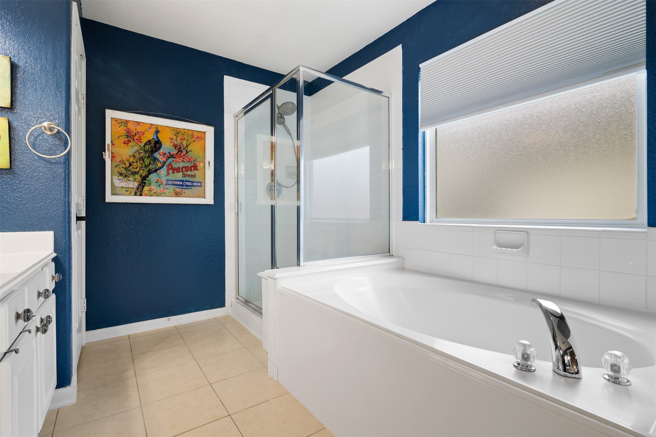 19306 Young Oak Street Spring, TX 77379 - Photo 17 of 28 Primary bathroom features separate garden tub and walk-in glass framed shower.