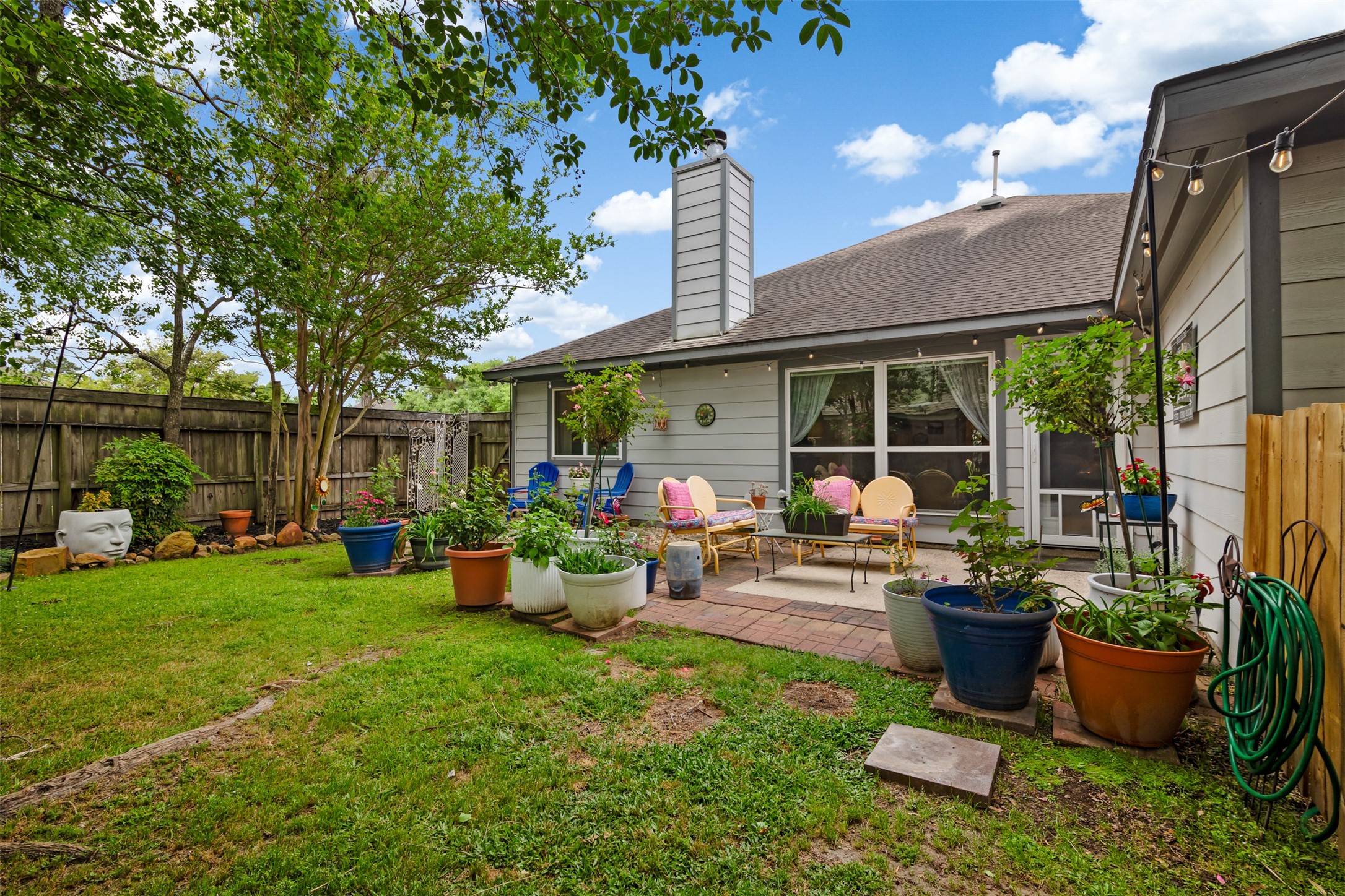 19306 Young Oak Street Spring, TX 77379 - Photo 24 of 28 Another view of the backyard oasis to include patio area perfect for outdoor entertaining.