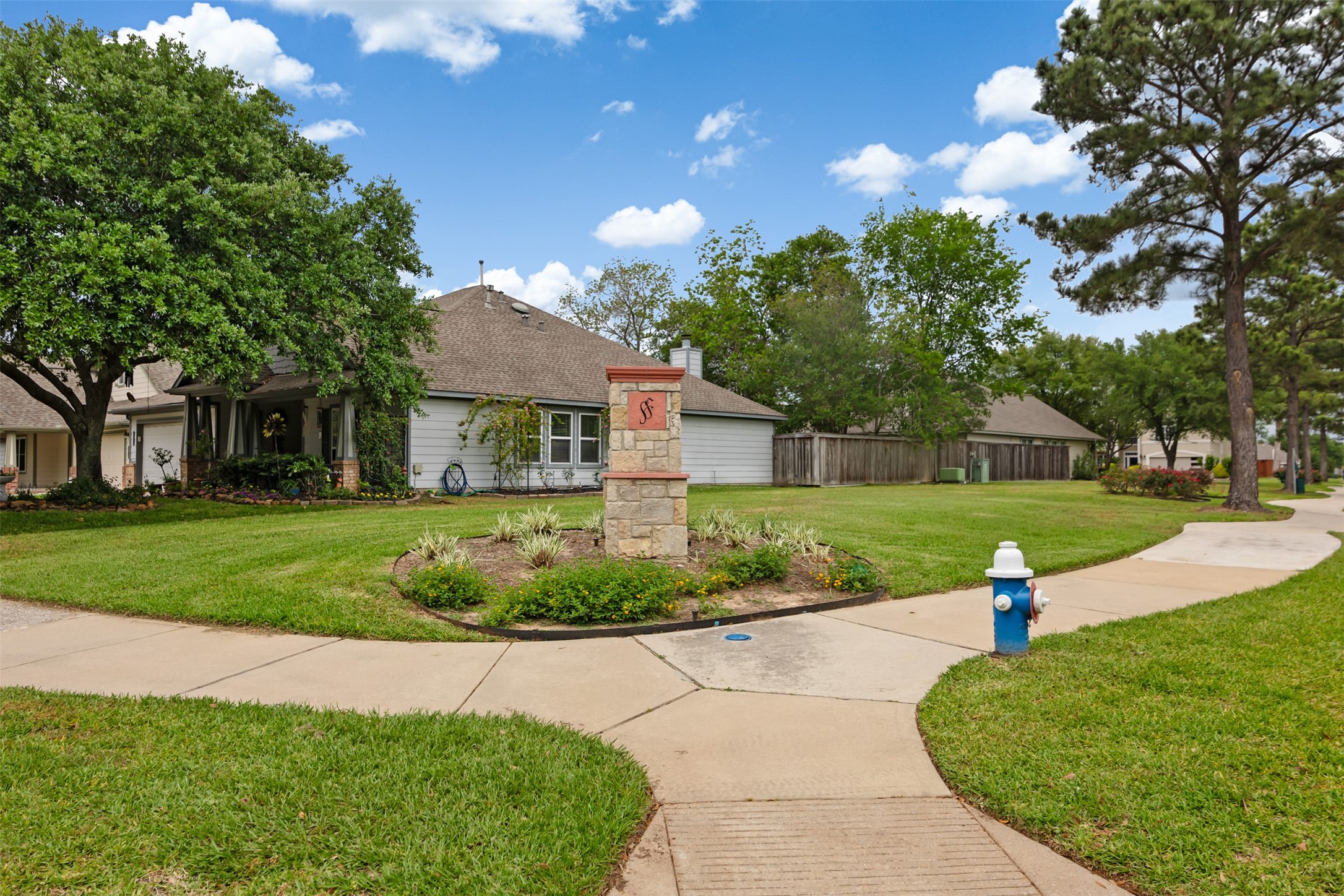 19306 Young Oak Street Spring, TX 77379 - Photo 26 of 28 View of the front of the home with large spacious corner lot and mature trees.