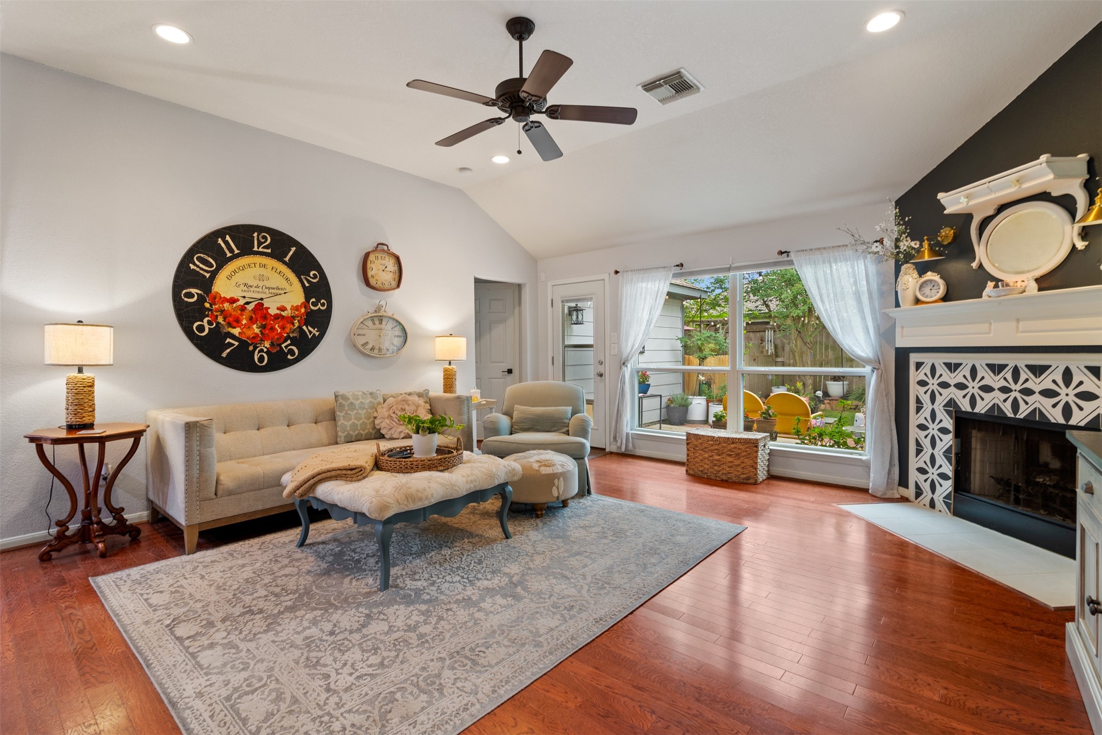 19306 Young Oak Street Spring, TX 77379 - Photo 9 of 28 The family room is open to the kitchen for open concept living and has large window looking out to the backyard.
