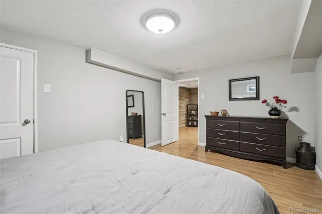 a bedroom with a bed and a dresser