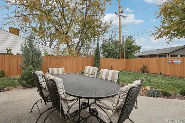 a view of a patio in the backyard