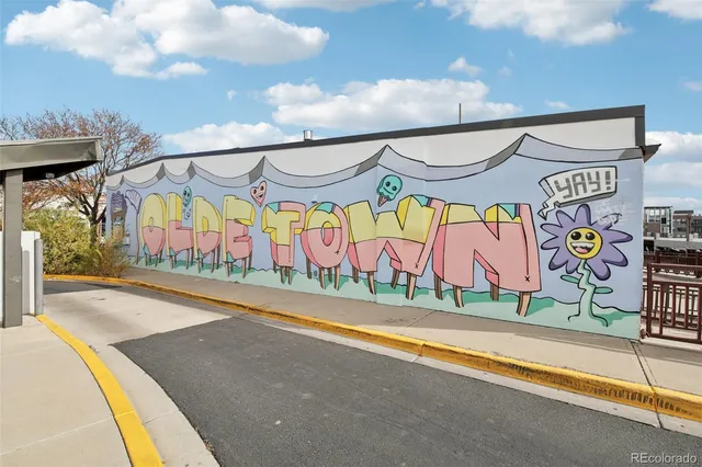 a street view with yellow walls