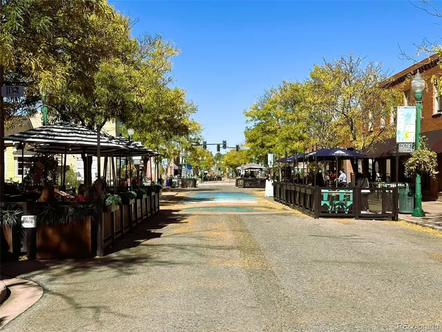 a view of street with sitting area