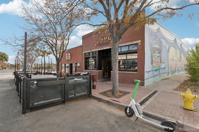 a view of a patio with a table and chairs