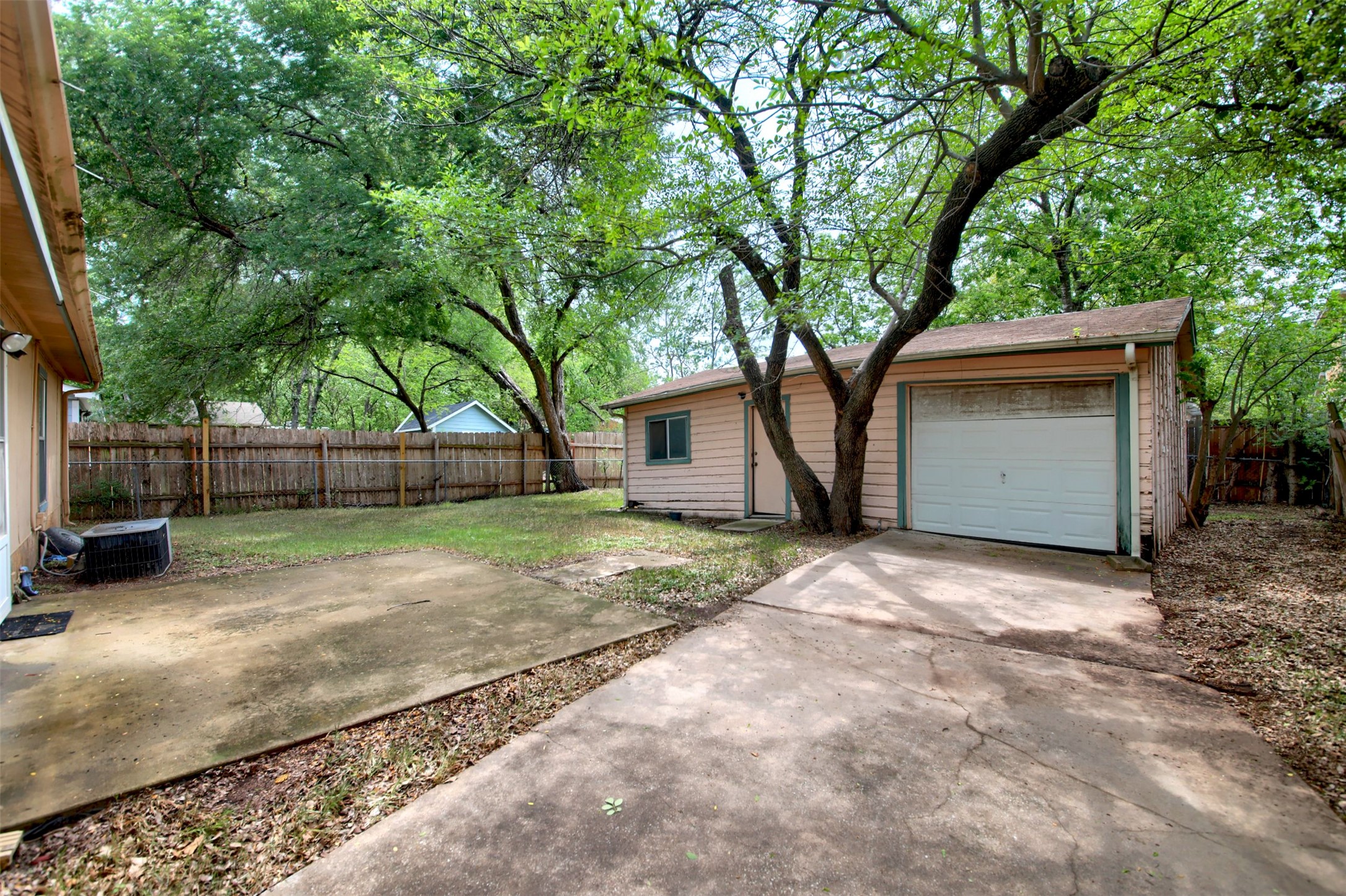 6115 Carnation Terrace Austin, TX 78741 - Photo 3 of 4 a house with trees in front of it