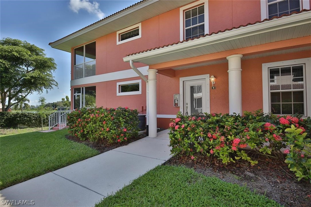 5220 Park Road, Unit 1 Fort Myers, FL 33908 - Photo 1 of 29 a view of a house with a yard and garden