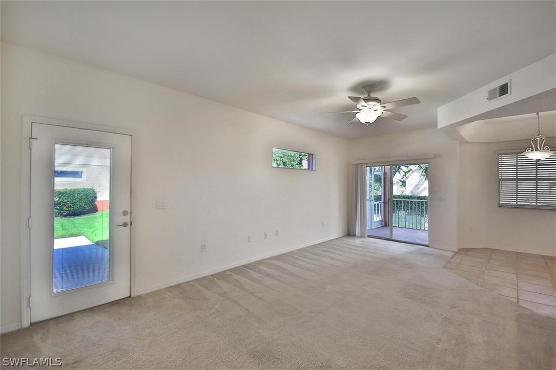 5220 Park Road, Unit 1 Fort Myers, FL 33908 - Photo 3 of 29 an empty room with windows and entrance