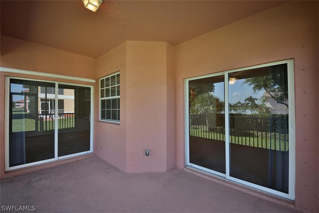5220 Park Road, Unit 1 Fort Myers, FL 33908 - Photo 6 of 29 a view of empty room with floor to ceiling window and glass door