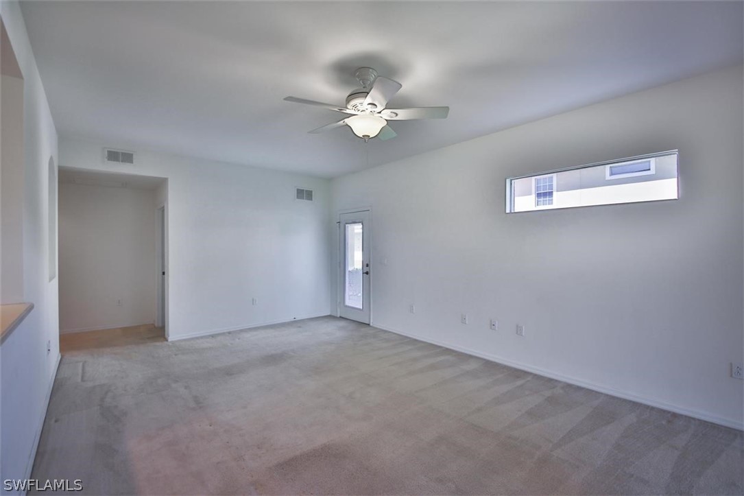 5220 Park Road, Unit 1 Fort Myers, FL 33908 - Photo 8 of 29 a view of an empty room with a ceiling fan