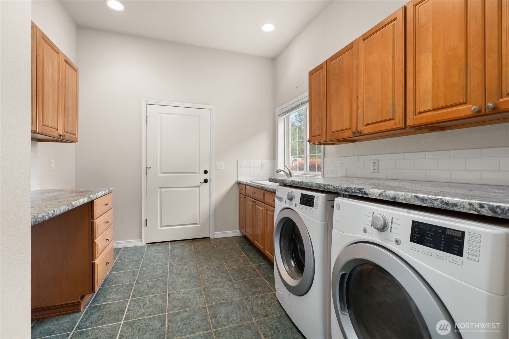 9609 346th Street South Roy, WA 98580 - Photo 26 of 37 a utility room with sink dryer and washer