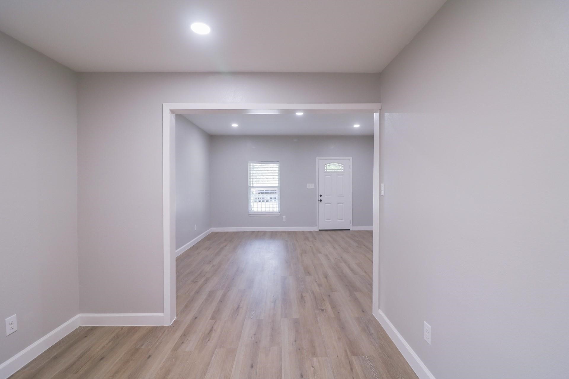 6150 Ridgeway Drive Houston, TX 77033 - Photo 19 of 36 a view of an empty room and wooden floor