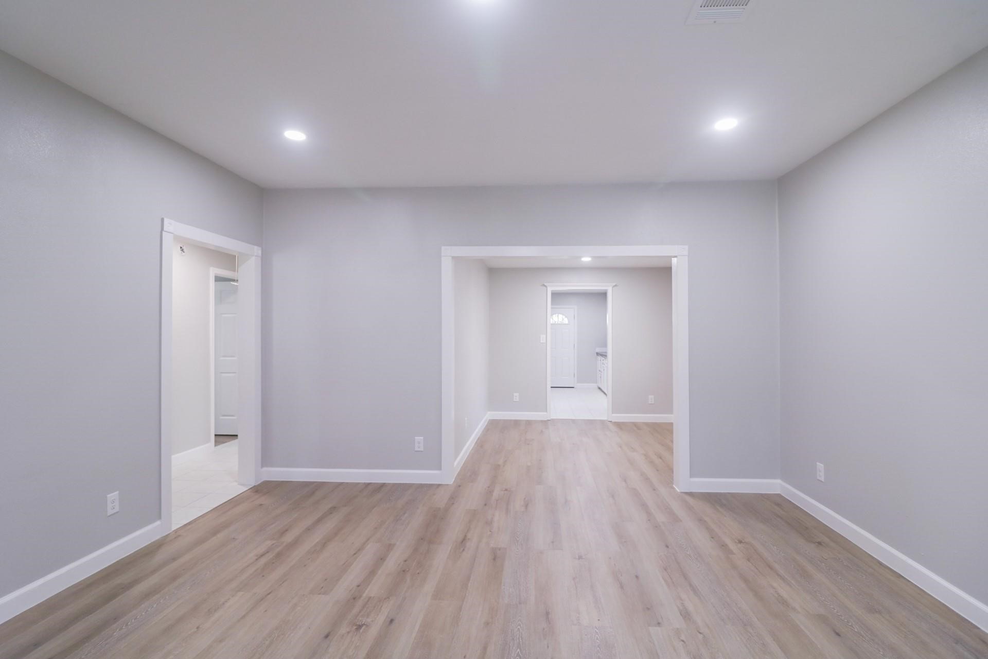 6150 Ridgeway Drive Houston, TX 77033 - Photo 20 of 36 a view of wooden floor and windows in a room
