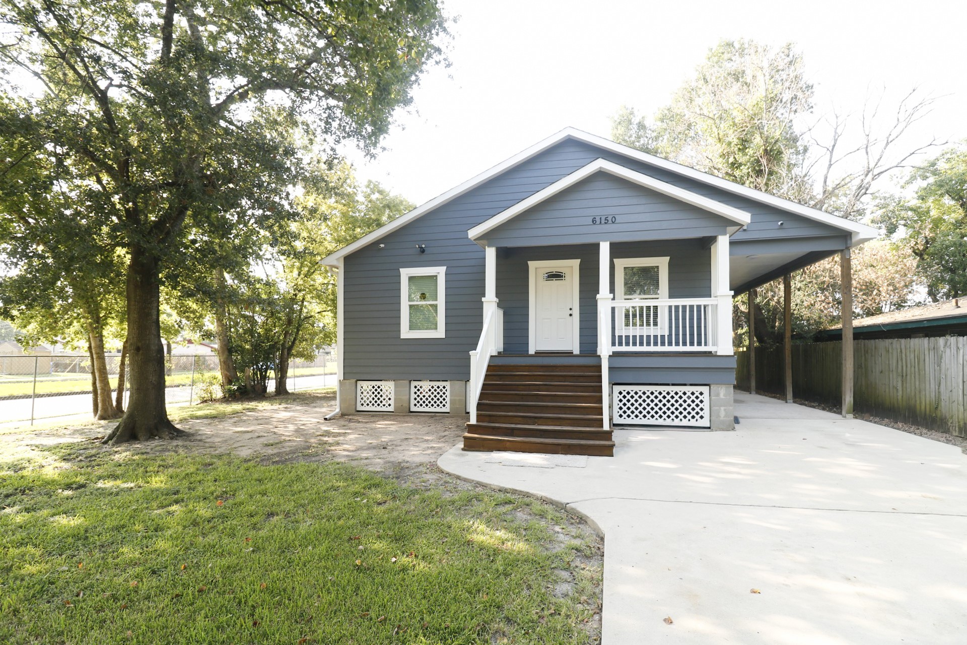 6150 Ridgeway Drive Houston, TX 77033 - Photo 2 of 36 a view of a house with a yard