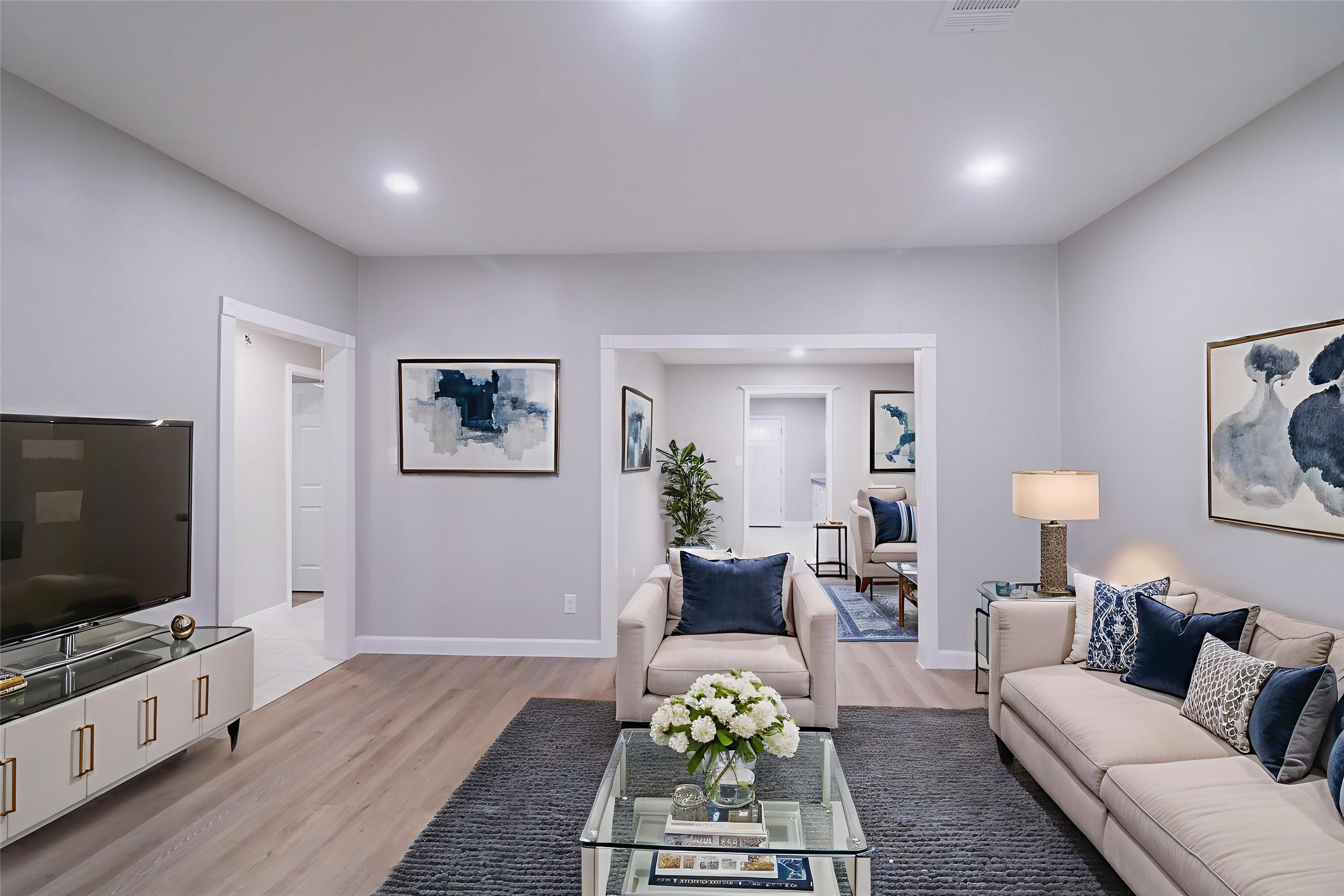 6150 Ridgeway Drive Houston, TX 77033 - Photo 3 of 36 a living room with furniture and a flat screen tv