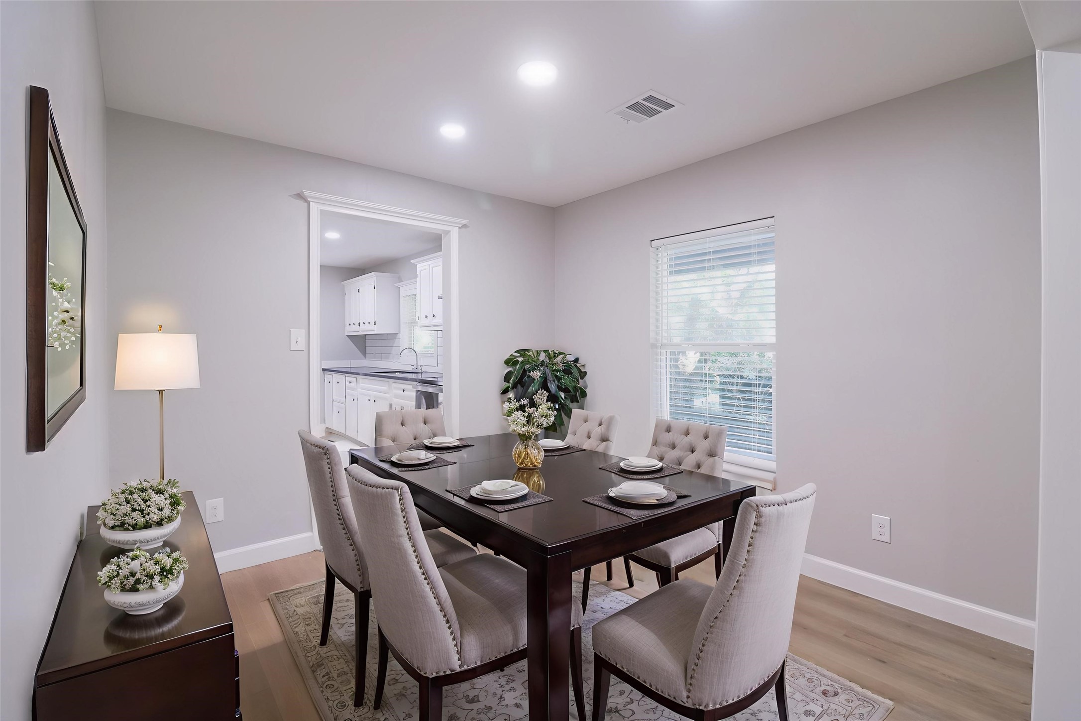 6150 Ridgeway Drive Houston, TX 77033 - Photo 4 of 36 a view of a dining room with furniture and wooden floor