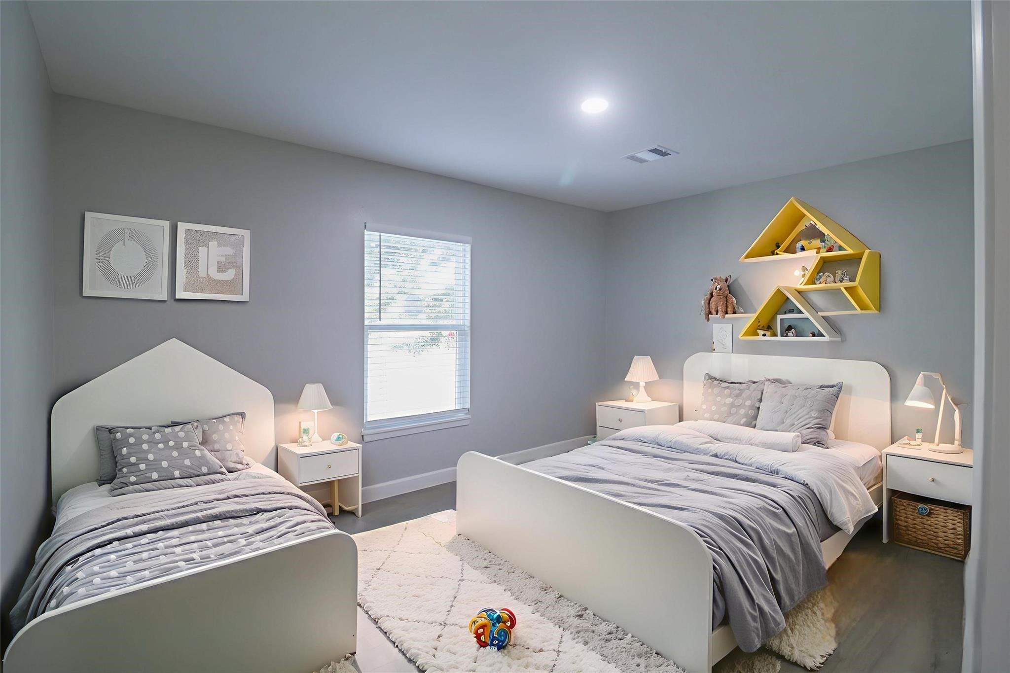 6150 Ridgeway Drive Houston, TX 77033 - Photo 10 of 36 a bedroom with a bed and painting on the wall