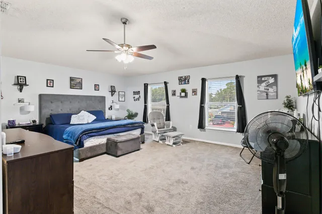 a view of a livingroom with furniture and a gym equipment